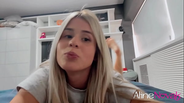 Busty blonde massaging her feet with oil and using her toy